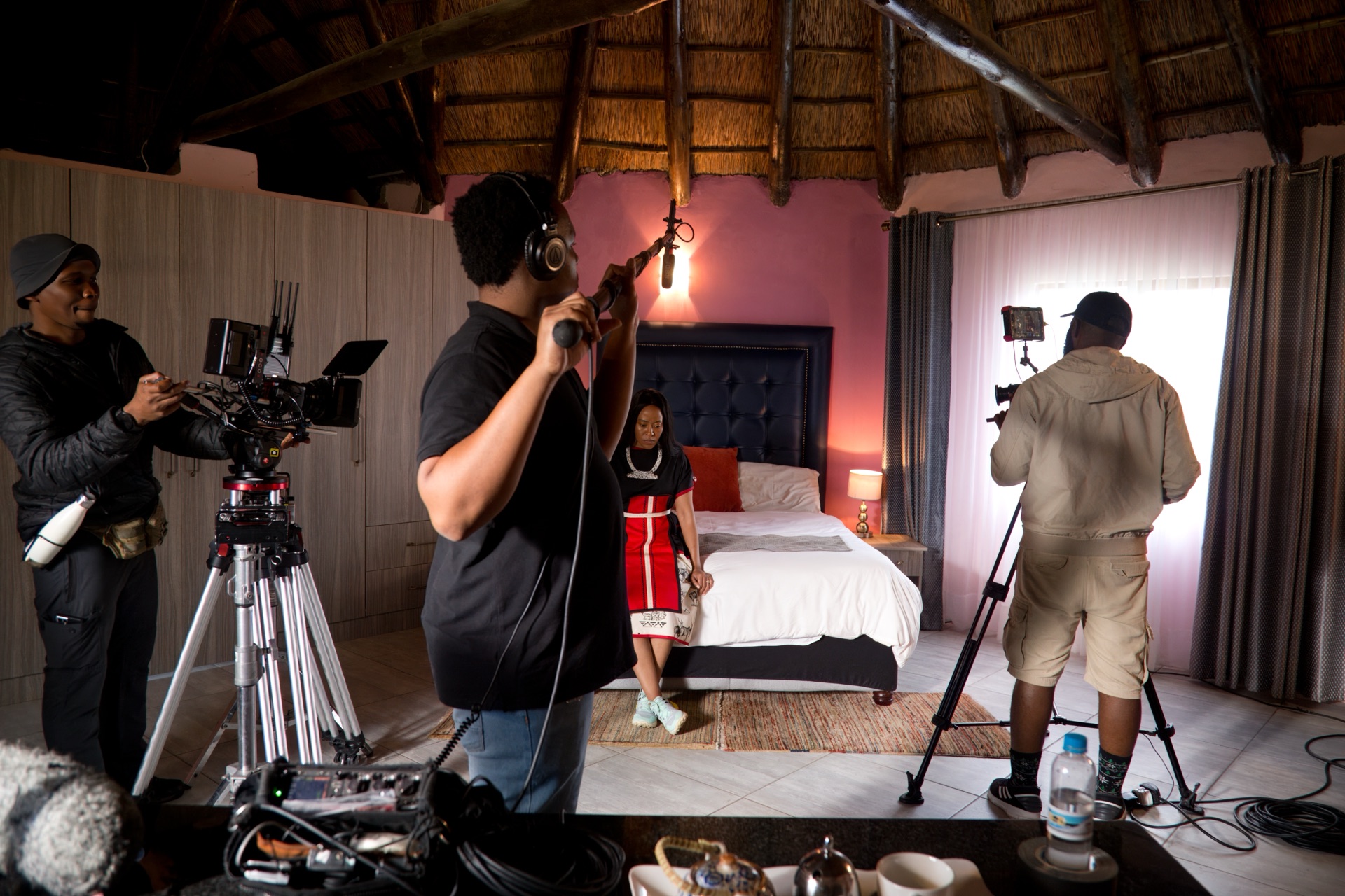 Interior set — crew filming a scene